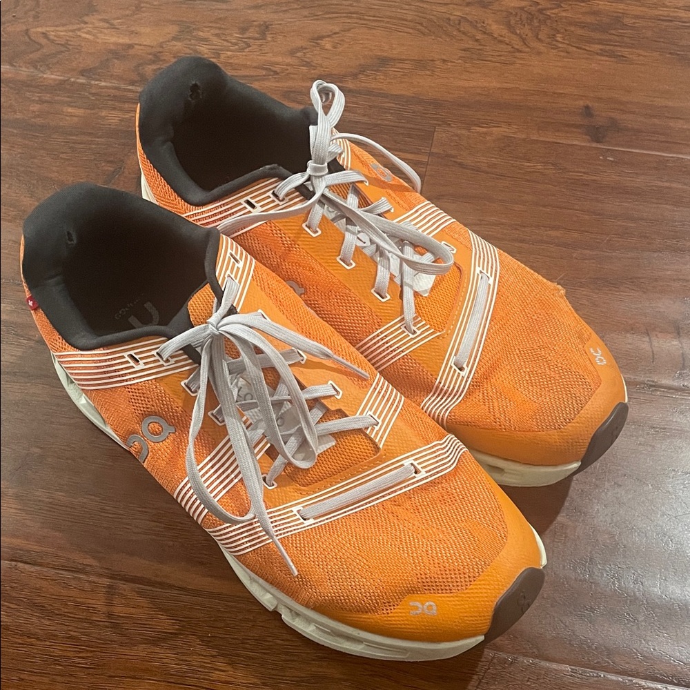 On Running Sneakers with Orange and White Details